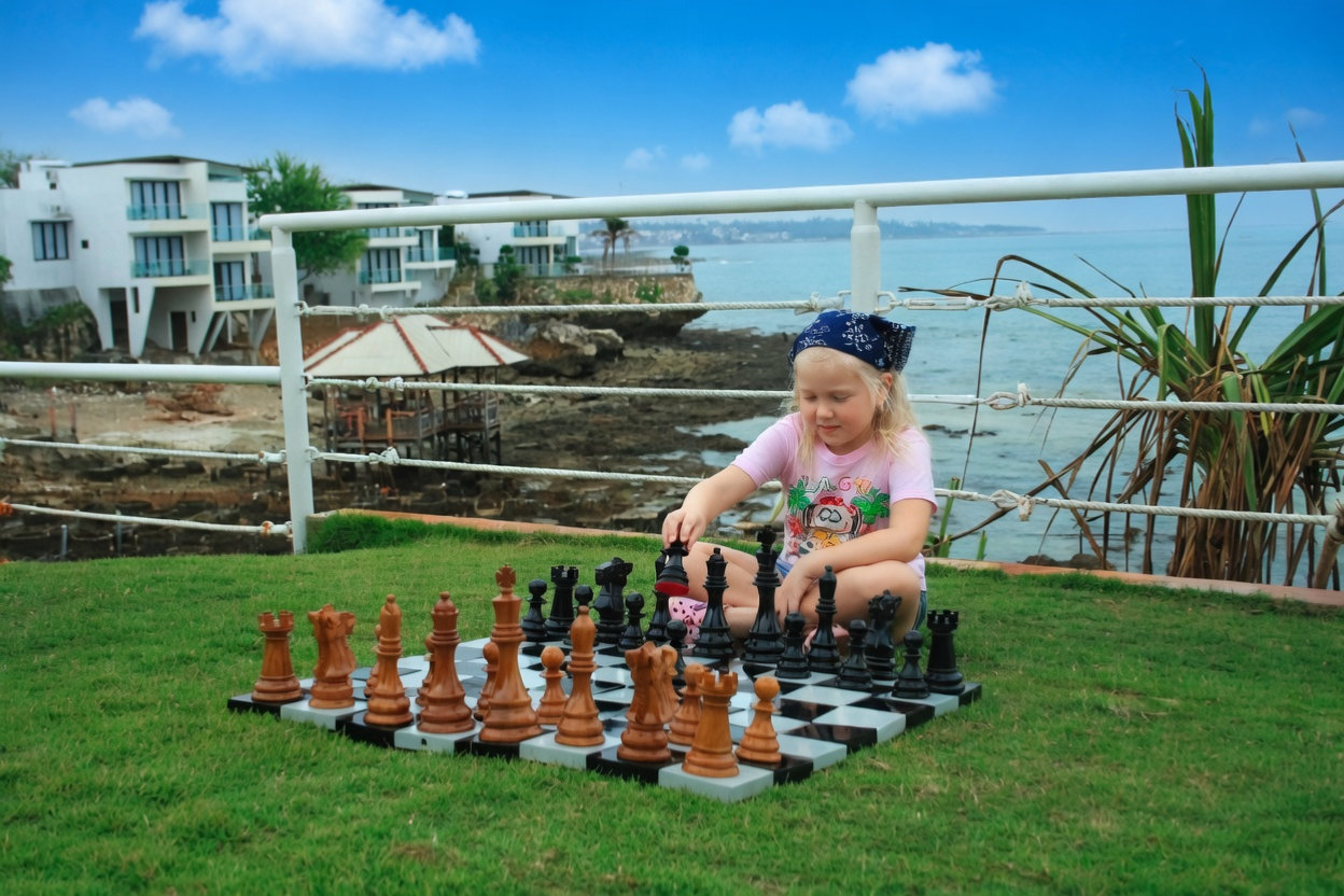 Luxury Resort Giant Chess Experience oversized outdoor chess set in luxury tropical resort environment