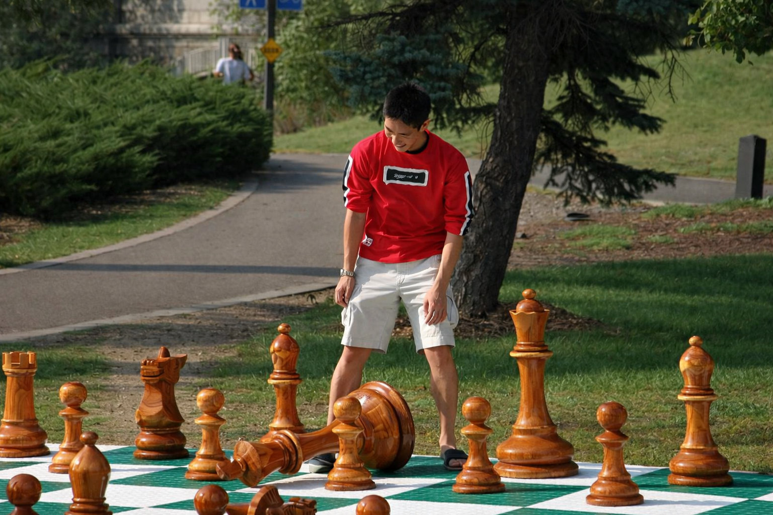 Premium Garden Chess Installation oversized outdoor chess set in luxury tropical resort environment