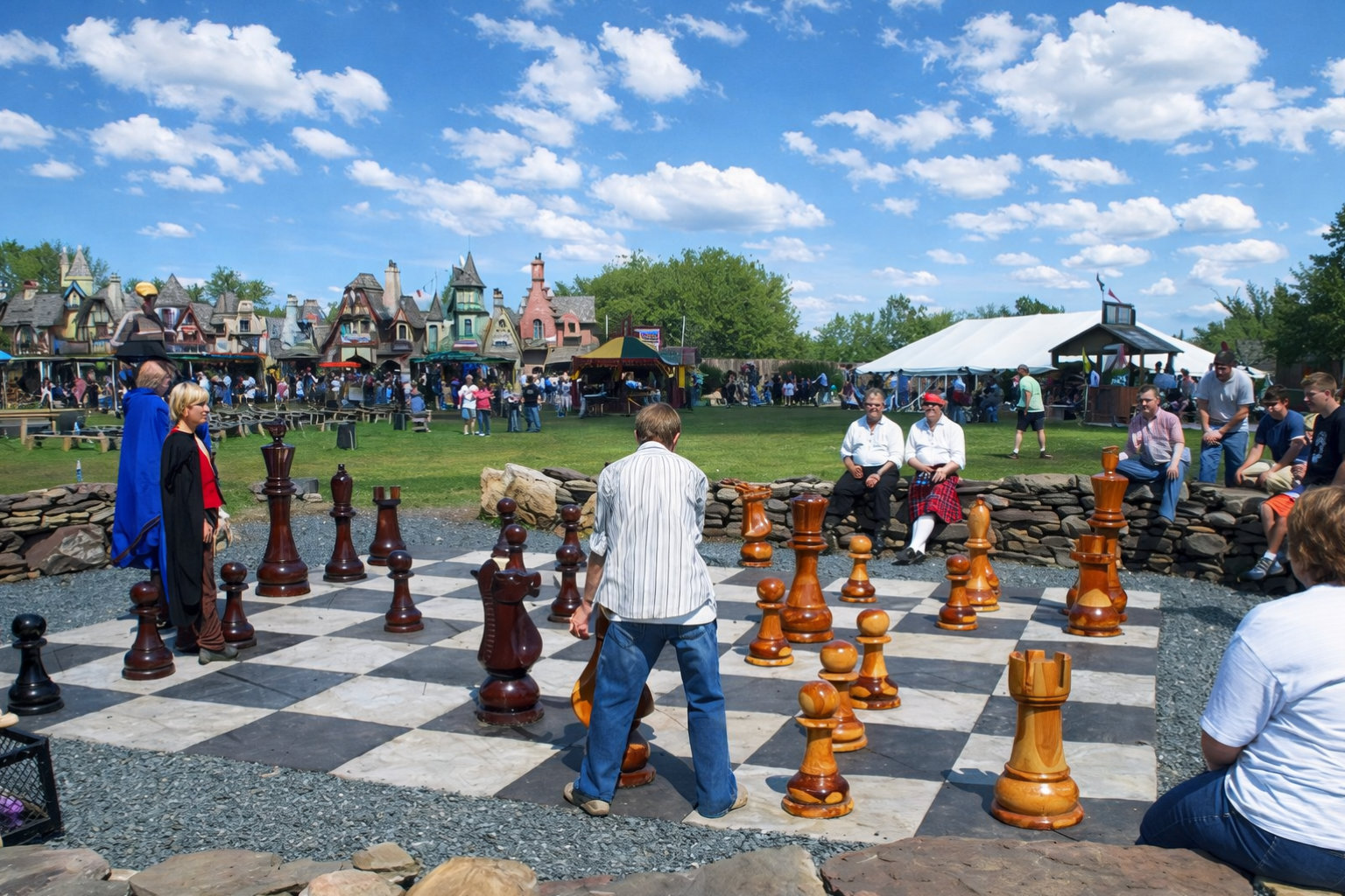 Exclusive Giant Chess Gallery oversized outdoor chess set in luxury tropical resort environment