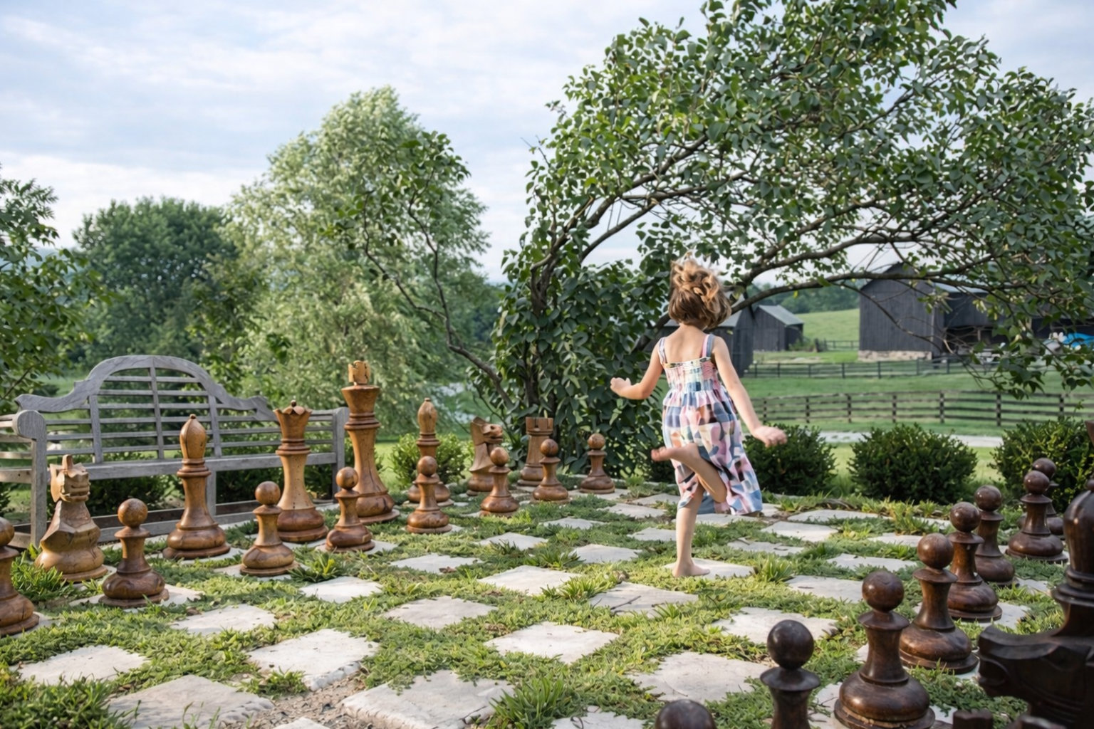 Premium Garden Chess Installation oversized outdoor chess set in luxury tropical resort environment