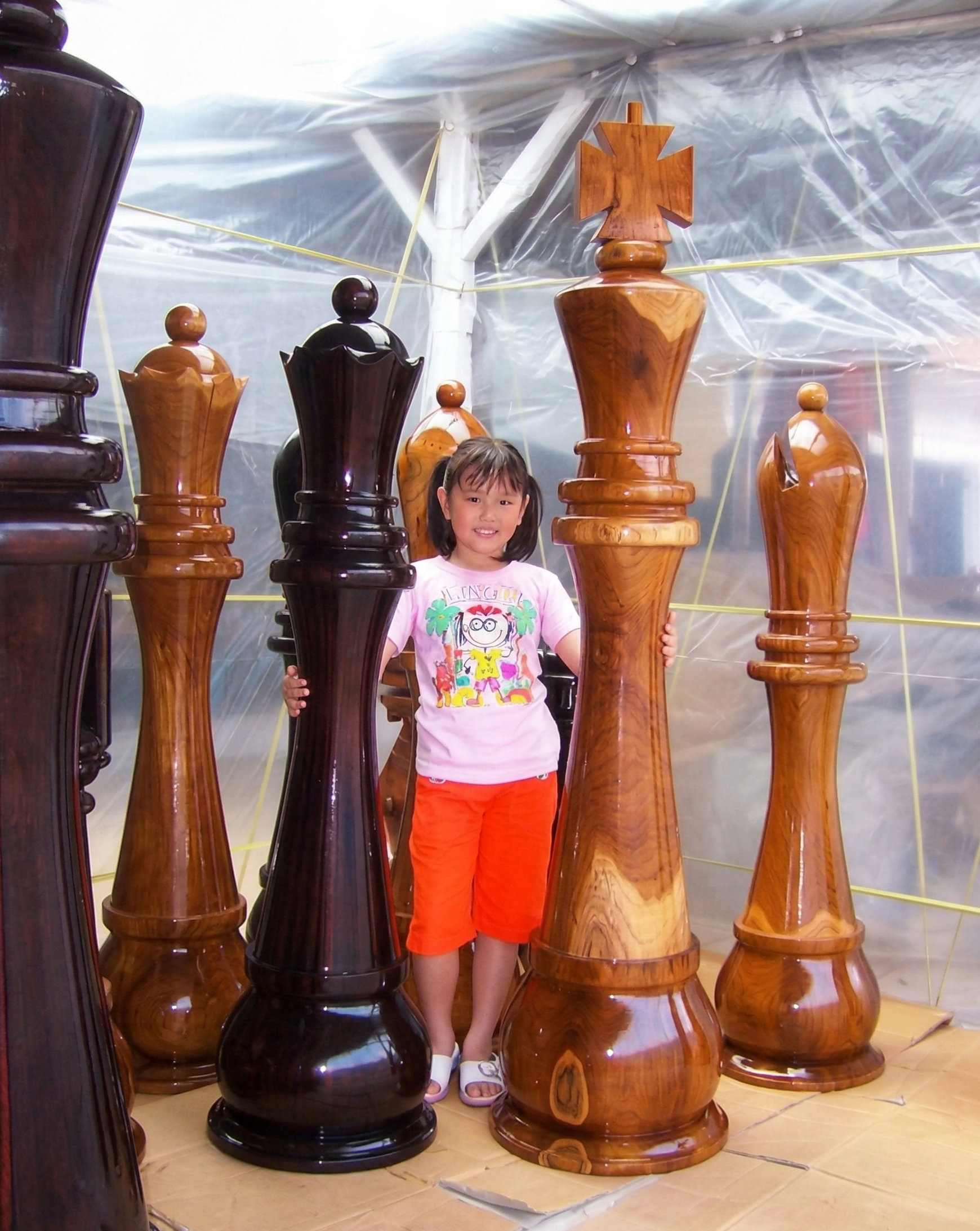 Elegant Outdoor Chess Collection oversized outdoor chess set in luxury tropical resort environment