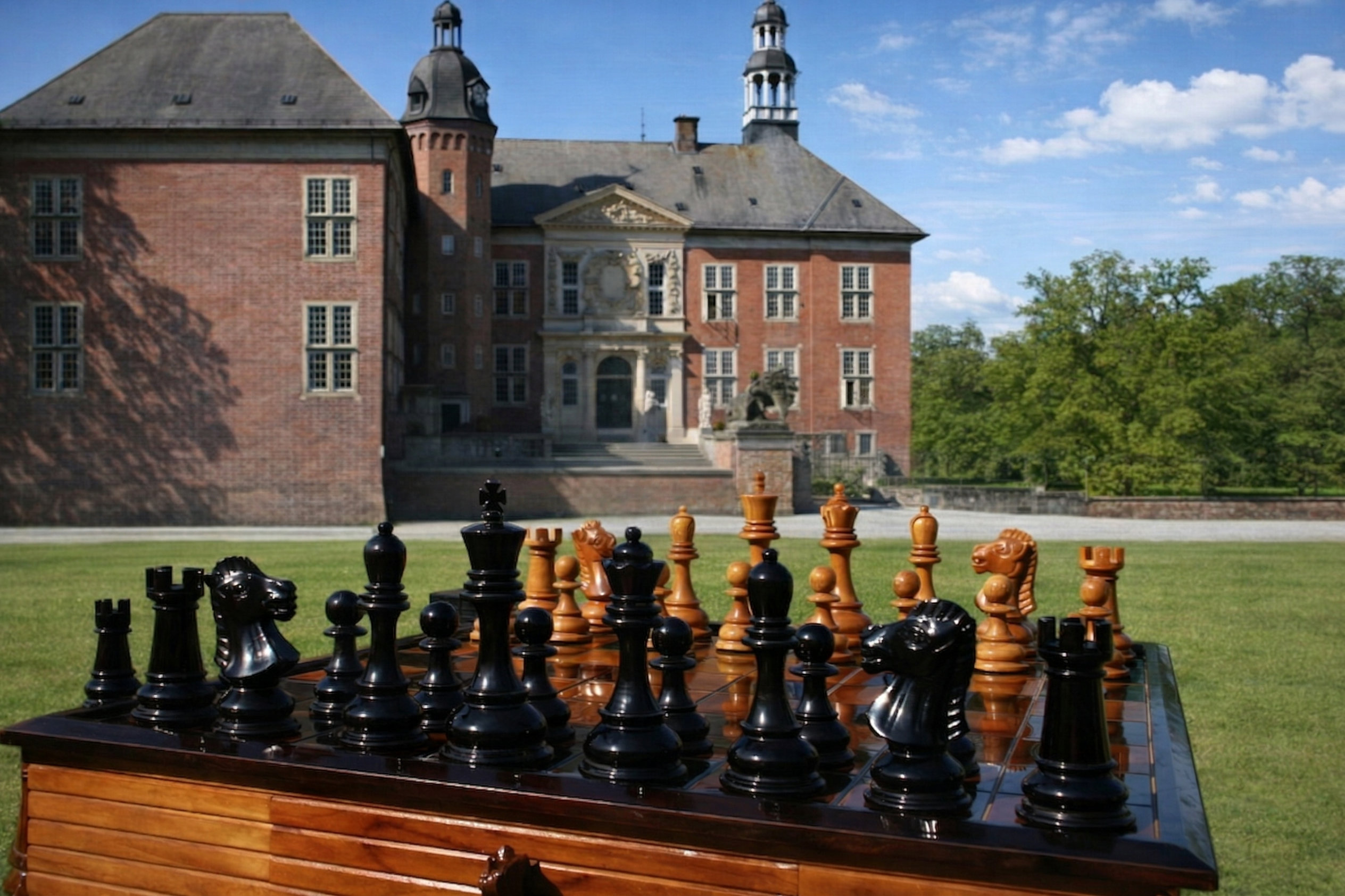 Premium Garden Chess Installation oversized outdoor chess set in luxury tropical resort environment