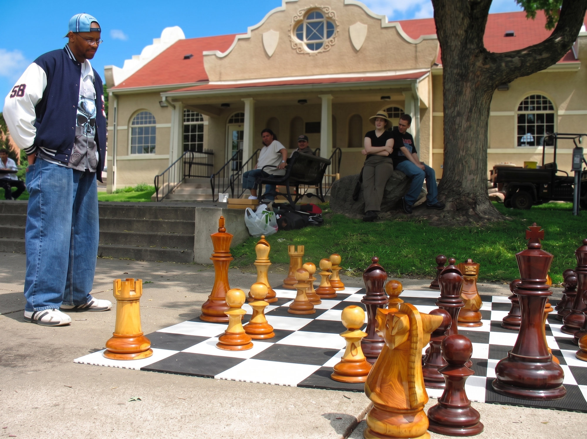 Exclusive Giant Chess Gallery oversized outdoor chess set in luxury tropical resort environment