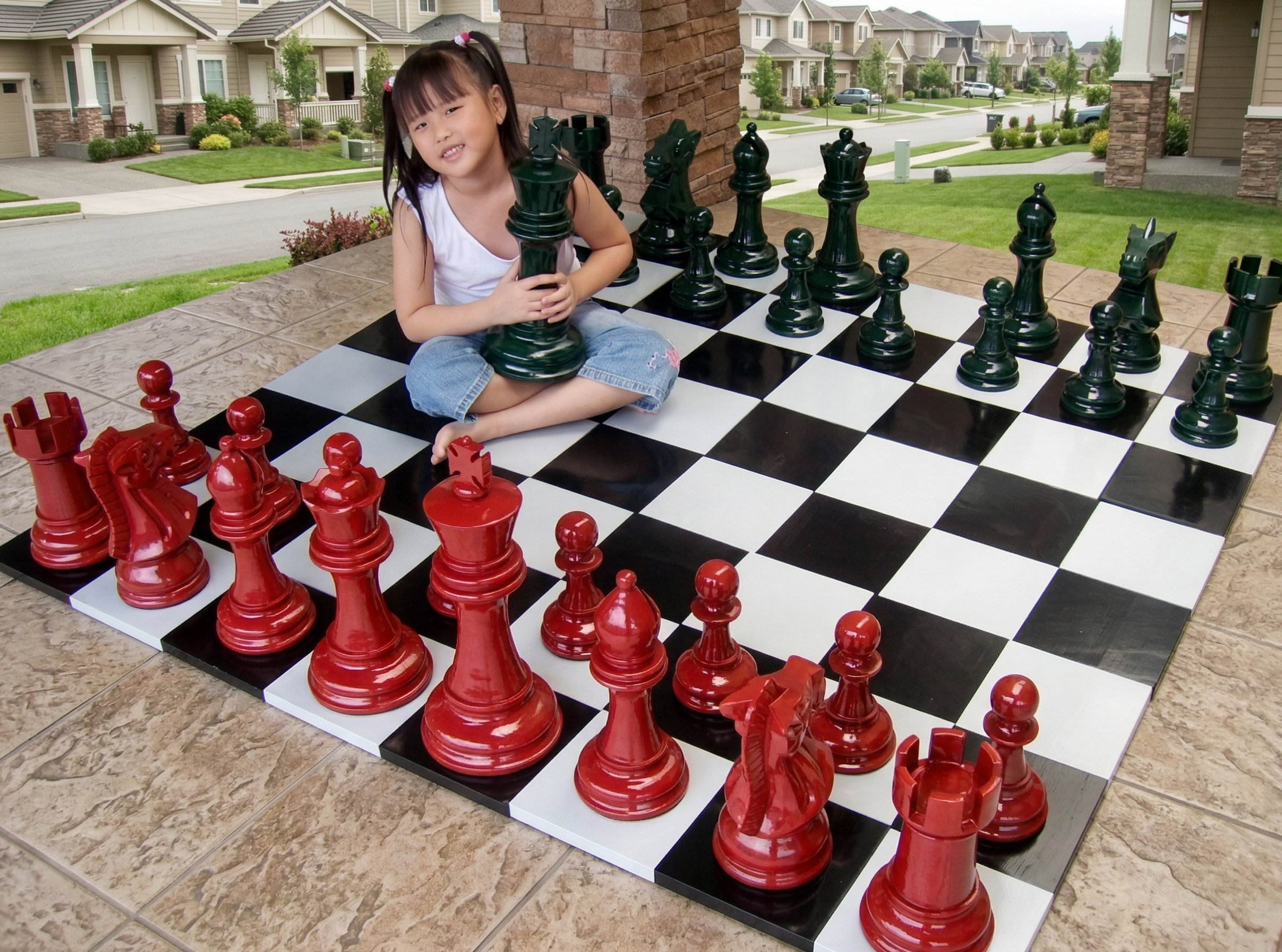 Premium Garden Chess Installation oversized outdoor chess set in luxury tropical resort environment