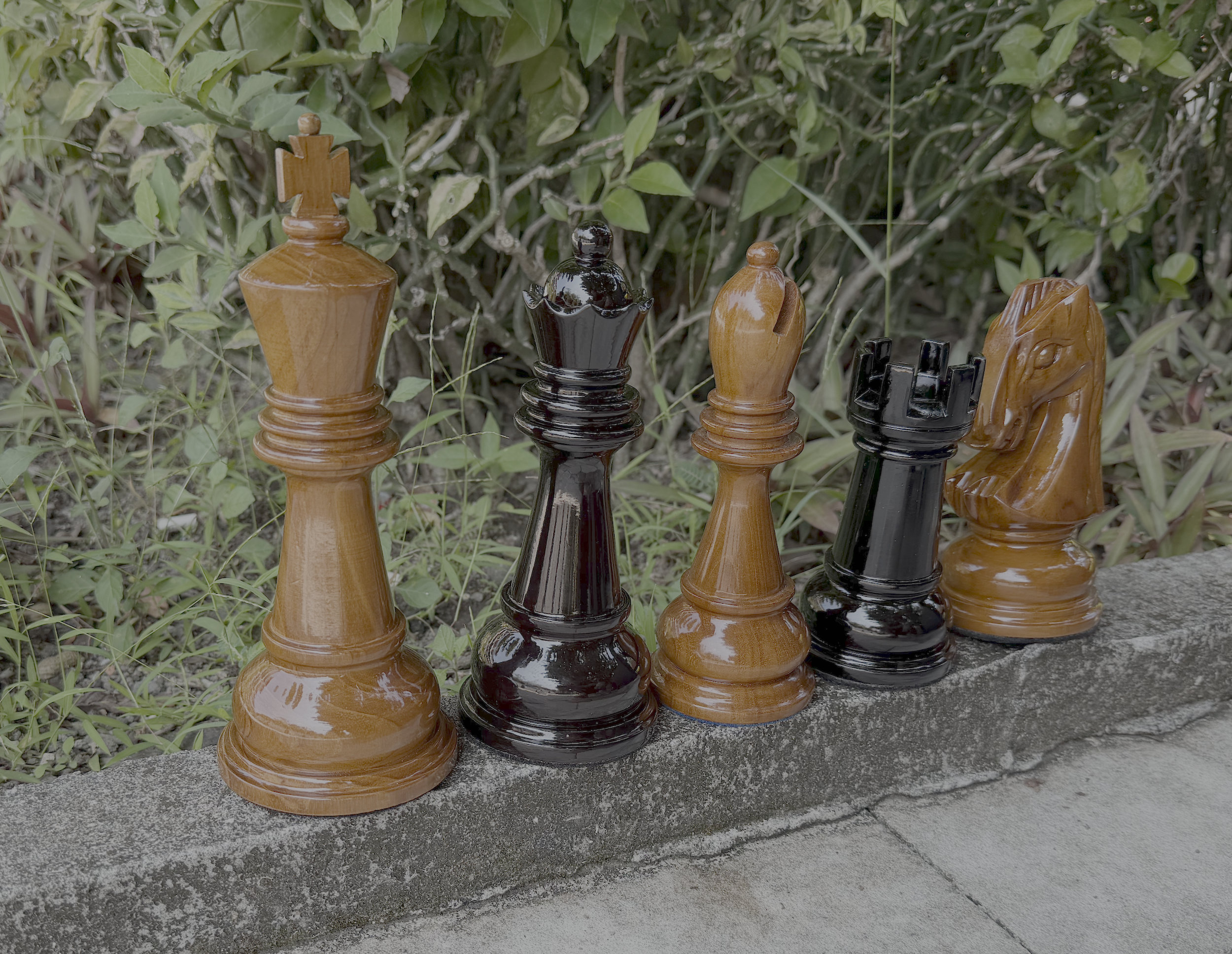 Exclusive Giant Chess Gallery oversized outdoor chess set in luxury tropical resort environment