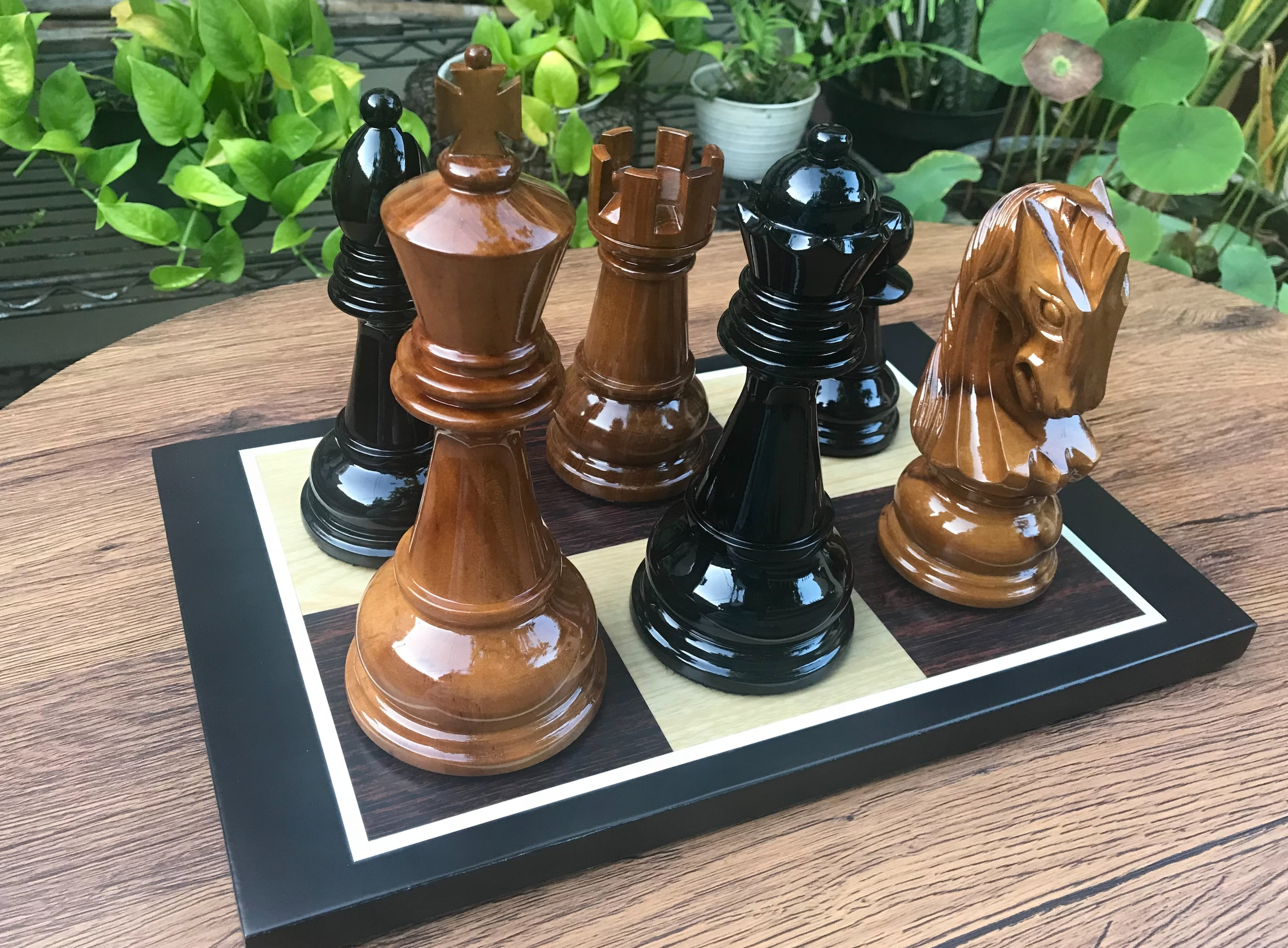 Exclusive Giant Chess Gallery oversized outdoor chess set in luxury tropical resort environment