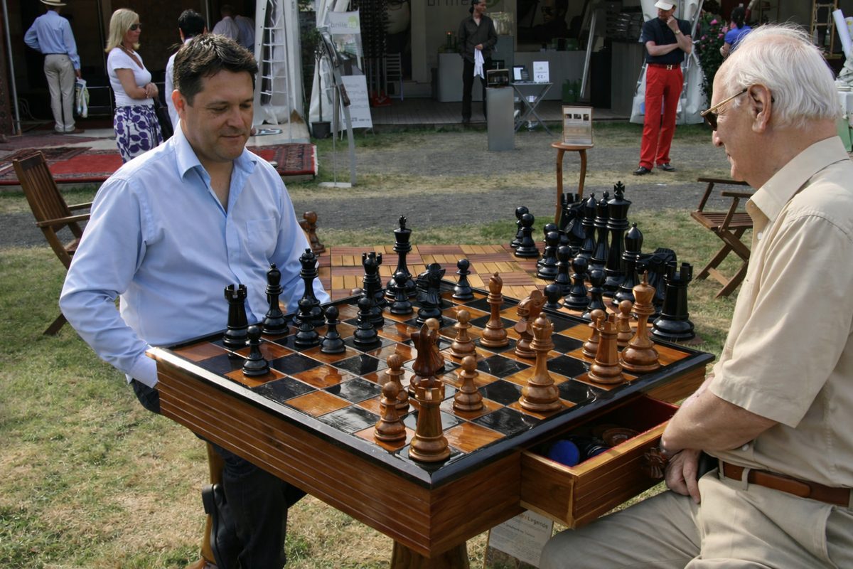 Thumbnail for The Art of the Game: Elevate Your Outdoor Leisure with Hand-Carved Teak Chess Tables
